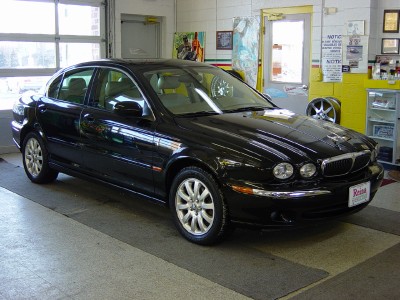 2003 Jaguar X-Type 4dr Sdn 3.0L: Photo: Rear 3/4 View. Rear 3/4 angle view.